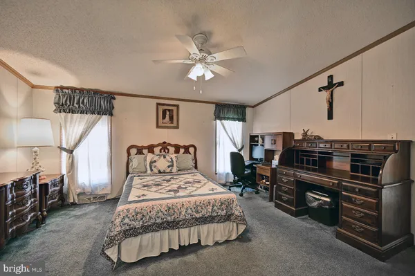 a bedroom with a bed and furniture