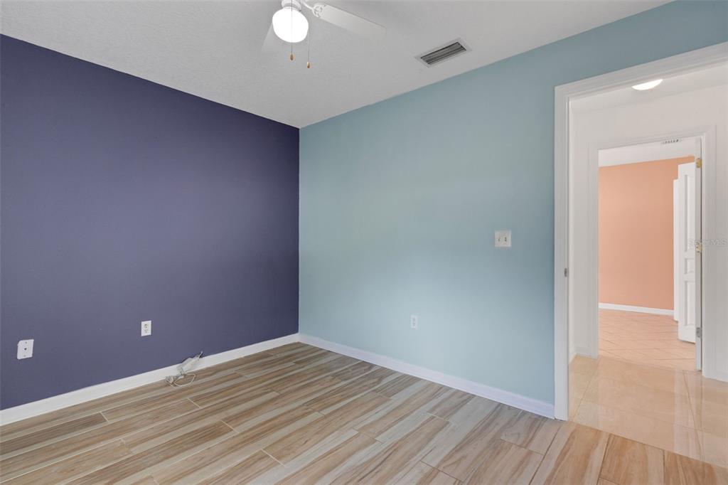 4557 Worcester Road Sarasota, FL 34231 - Photo 30 of 50 a view of empty room with wooden floor