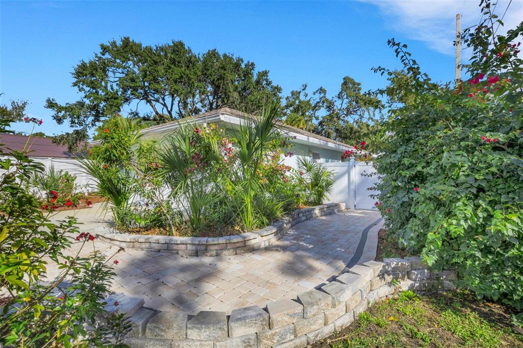 4557 Worcester Road Sarasota, FL 34231 - Photo 3 of 50 a view of a garden