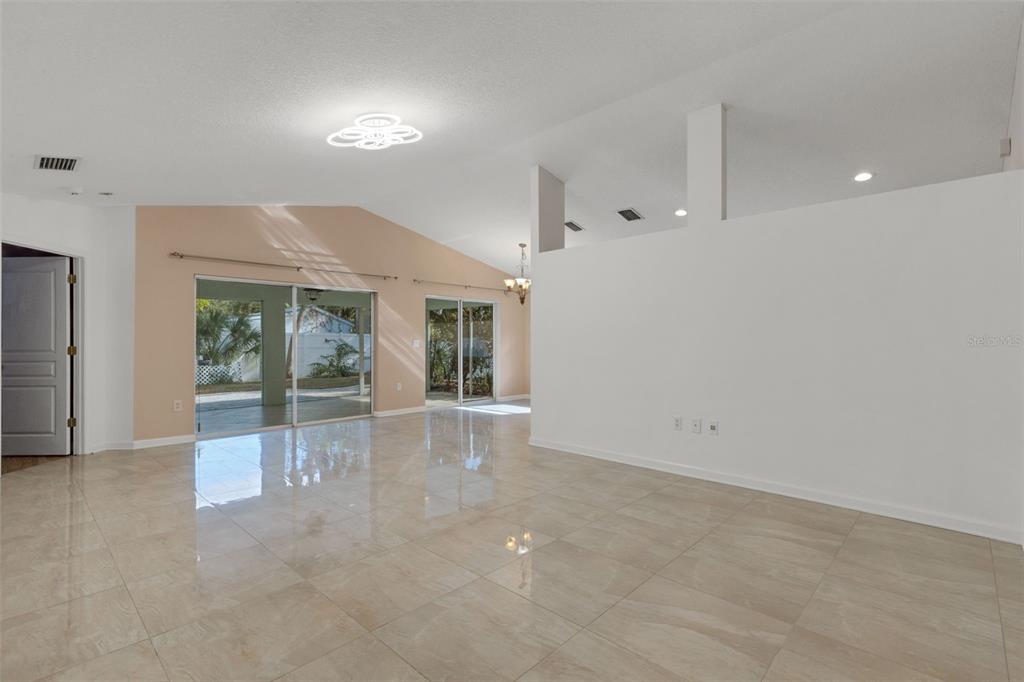 4557 Worcester Road Sarasota, FL 34231 - Photo 6 of 50 en empty room with windows