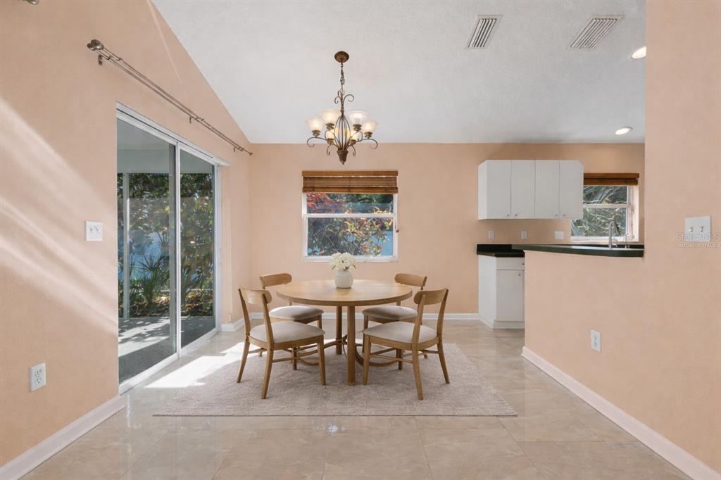 4557 Worcester Road Sarasota, FL 34231 - Photo 10 of 50 a dining room with furniture and window