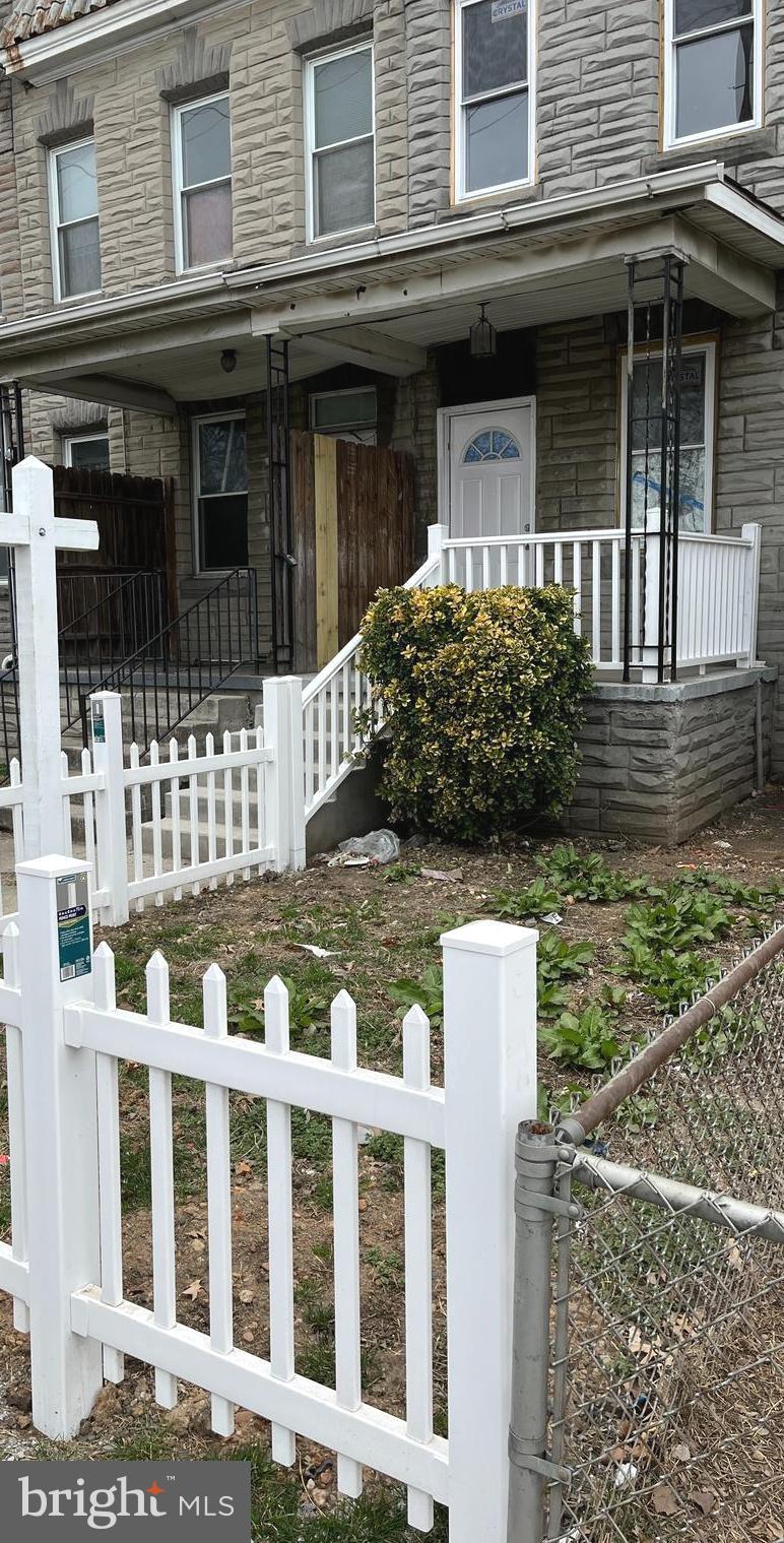 3808 Pennington Avenue Curtis Bay, MD 21226 - Photo 3 of 12 a front view of a house with a garden