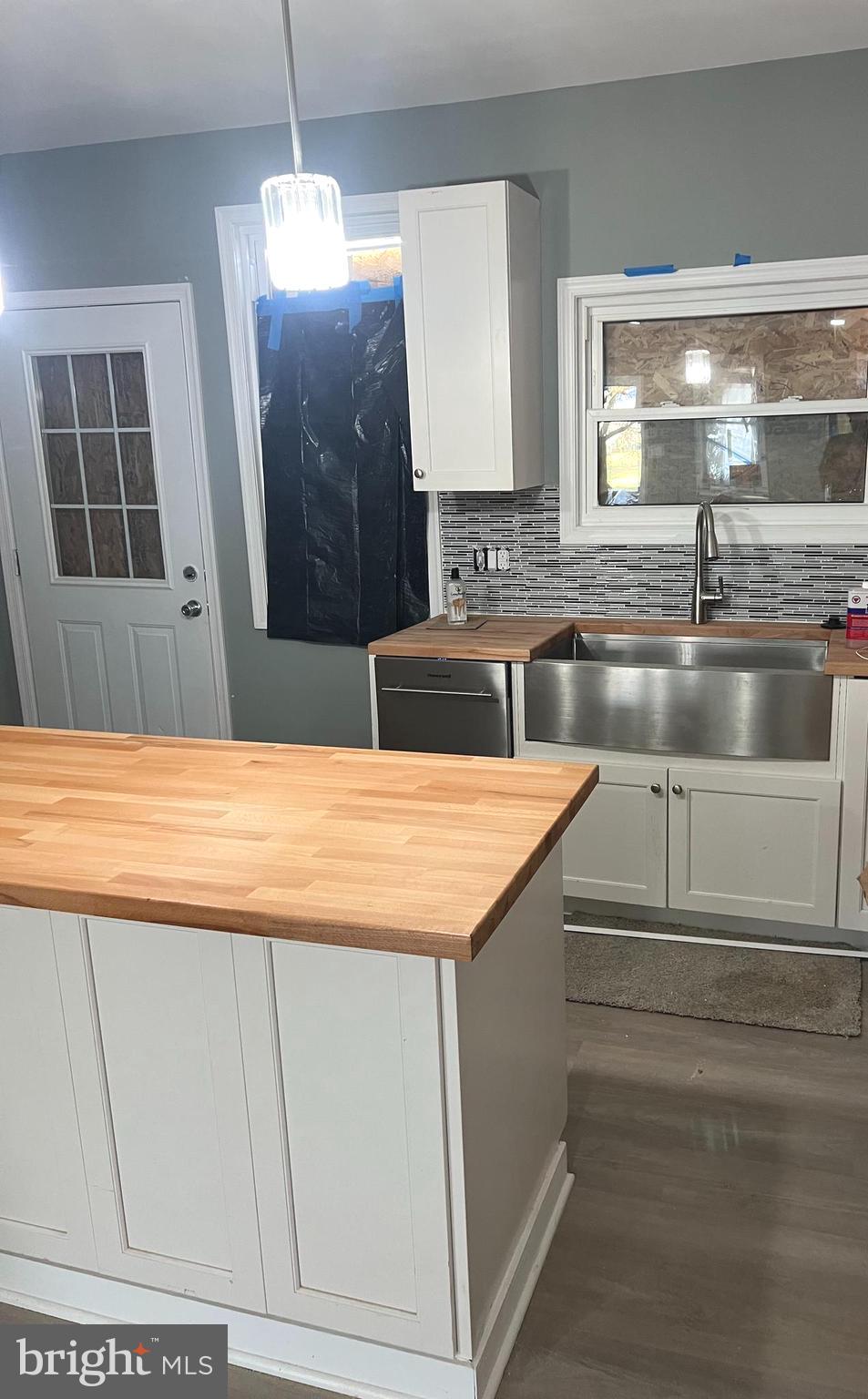 3808 Pennington Avenue Curtis Bay, MD 21226 - Photo 6 of 12 a kitchen with kitchen island a sink a counter top space and cabinets