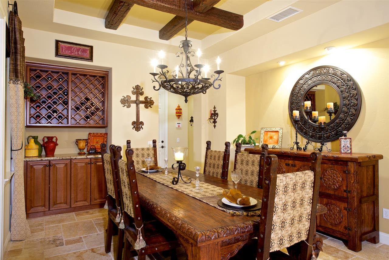 2436 Lapis Road Carlsbad, CA 92009 - Photo 8 of 25 In the dramatic formal dining room, you will find designer details including a box beam ceiling and elegant wrought iron chandelier