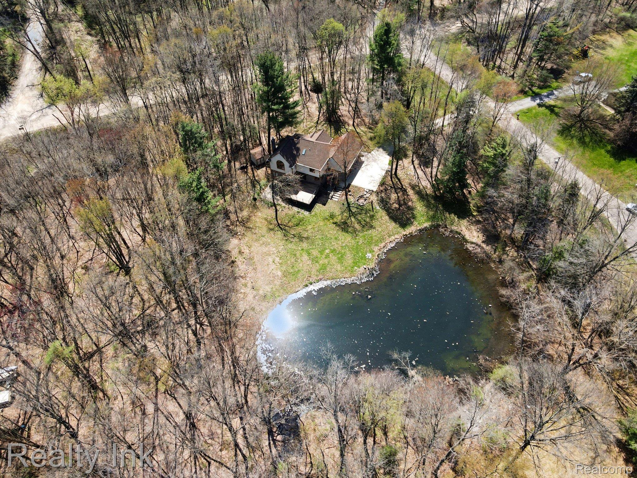 4927 Nature View Court Howell, MI 48843 - Photo 4 of 19 Aerial view of property and surrounding area featuring a nearby body of water