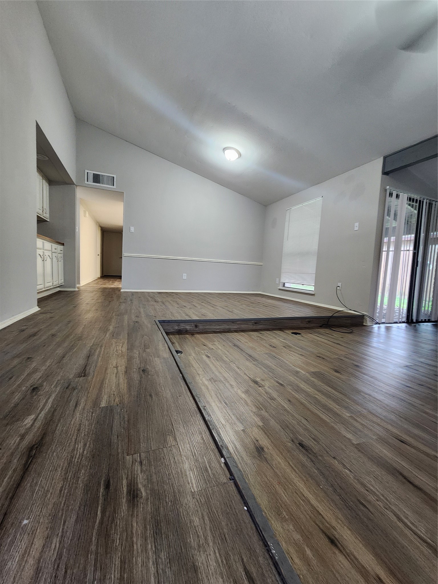 3822 Broken Elm Drive Spring, TX 77388 - Photo 6 of 25 wooden floor in an empty room with a window