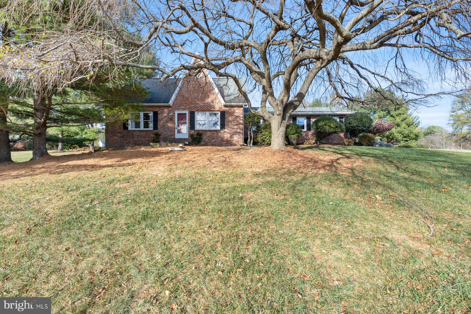 5130 Perry Road Mount Airy, MD 21771 - Photo 1 of 46 a front view of a house with a yard and large trees