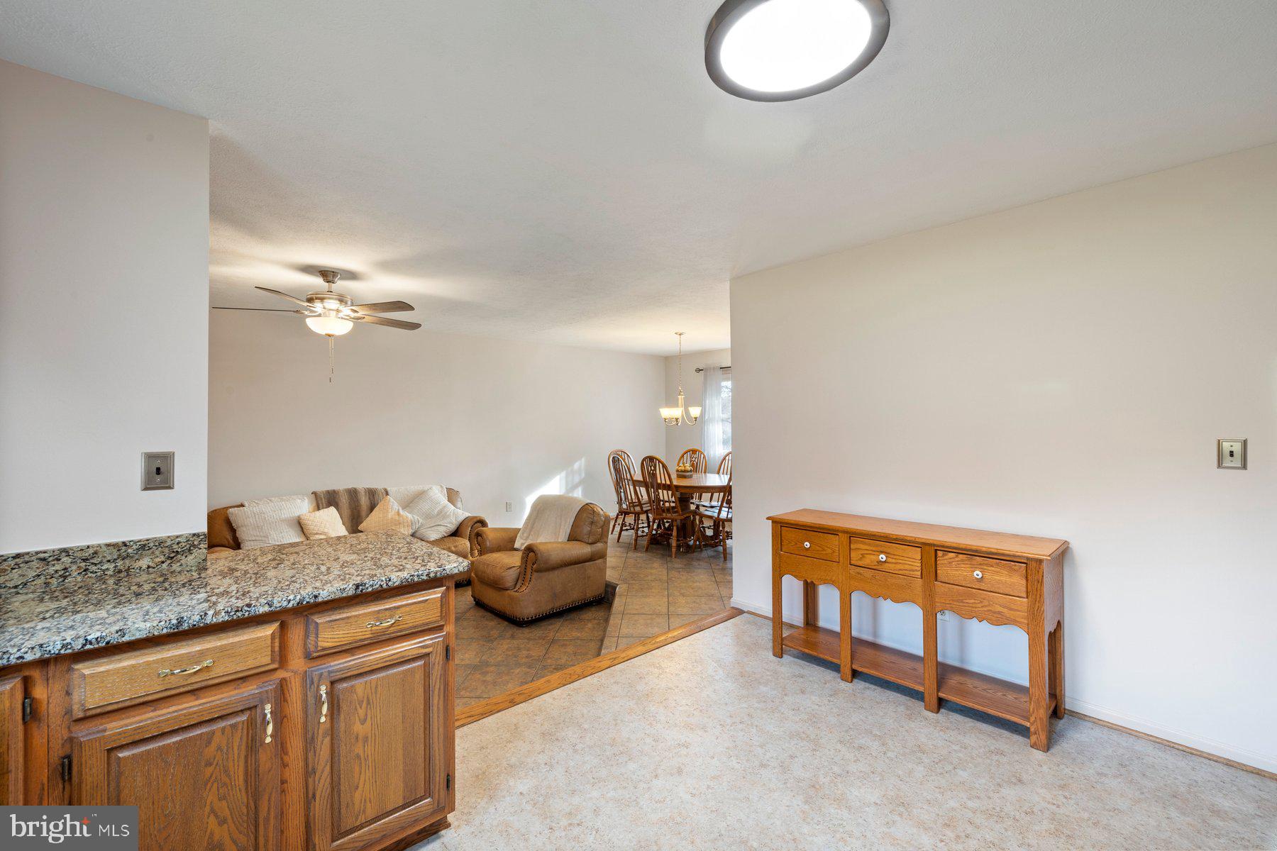 5130 Perry Road Mount Airy, MD 21771 - Photo 12 of 46 a spacious bedroom with a bed a couch and chandelier