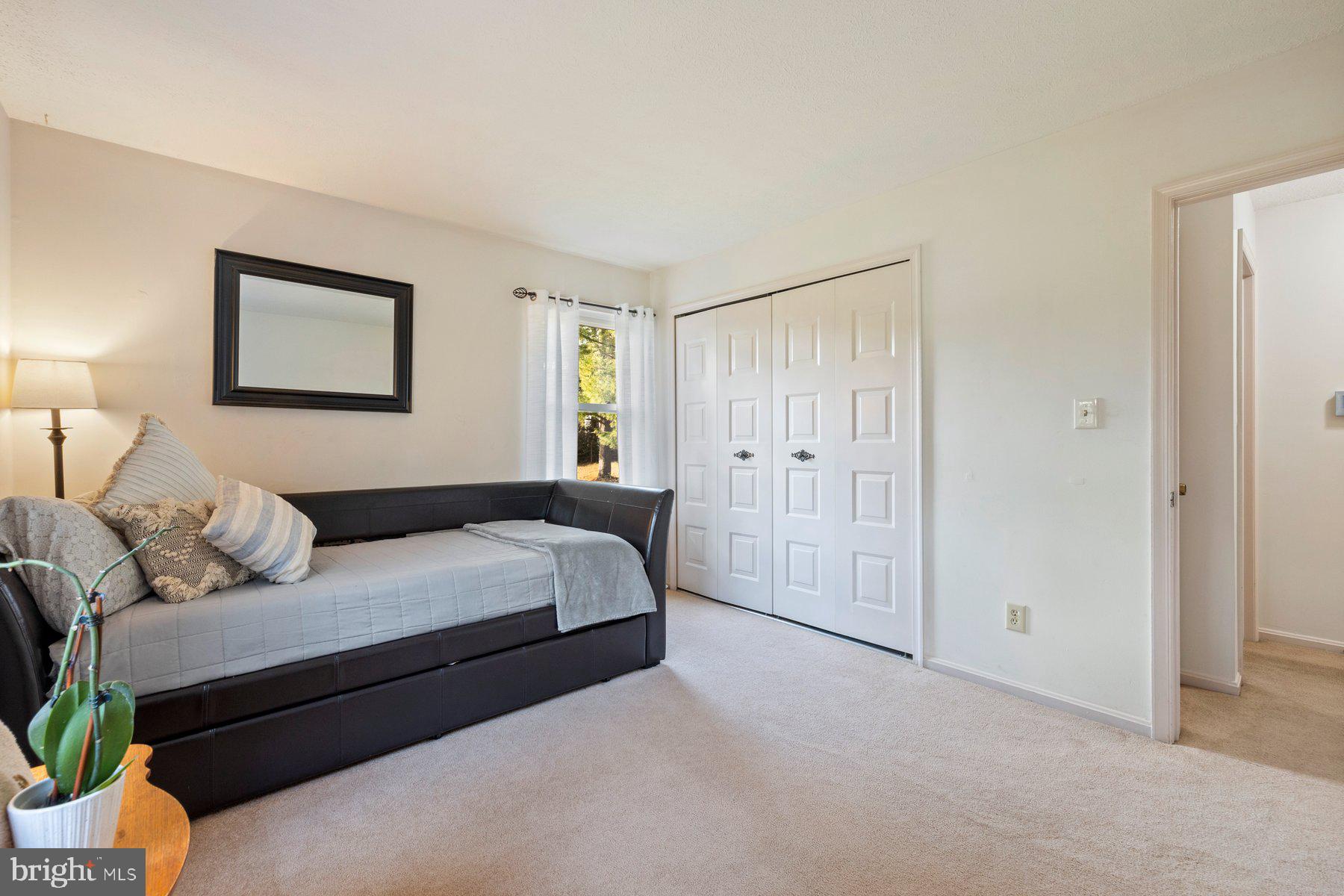 5130 Perry Road Mount Airy, MD 21771 - Photo 16 of 46 a spacious bedroom with a bed and a couch