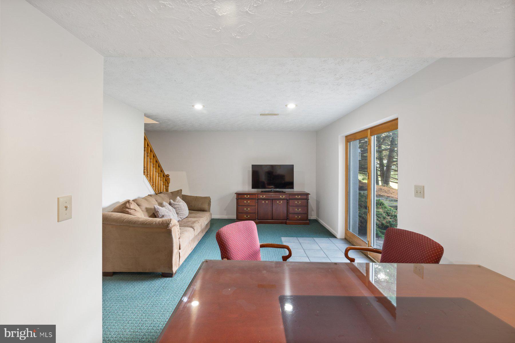 5130 Perry Road Mount Airy, MD 21771 - Photo 28 of 46 a living room with furniture and a flat screen tv