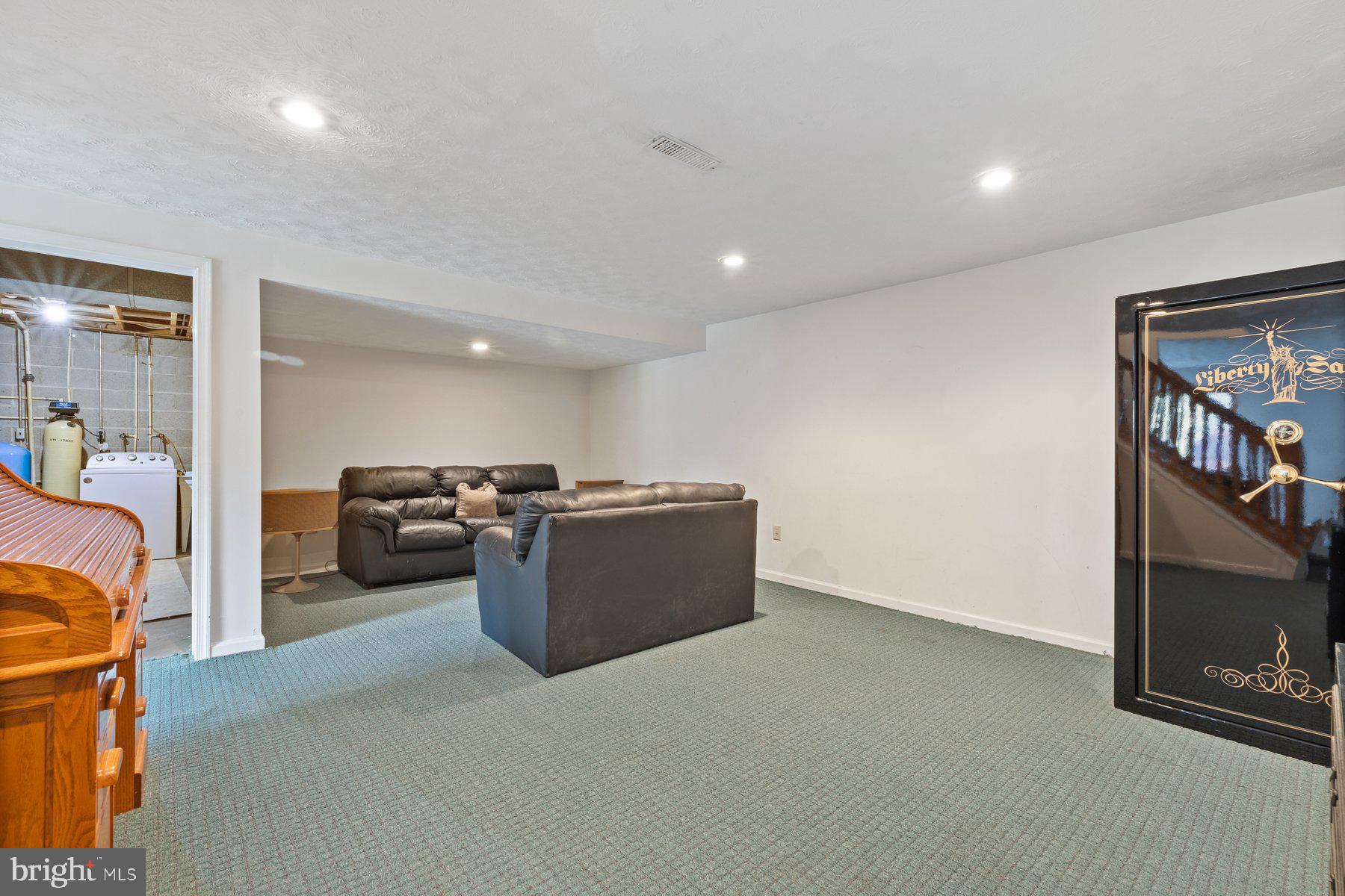 5130 Perry Road Mount Airy, MD 21771 - Photo 30 of 46 a living room with furniture and a flat screen tv