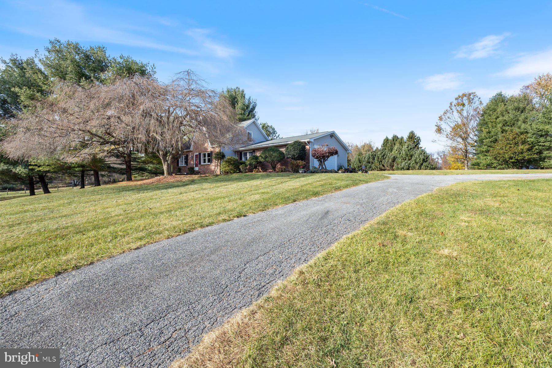 5130 Perry Road Mount Airy, MD 21771 - Photo 42 of 46 a front view of a house with a yard and trees