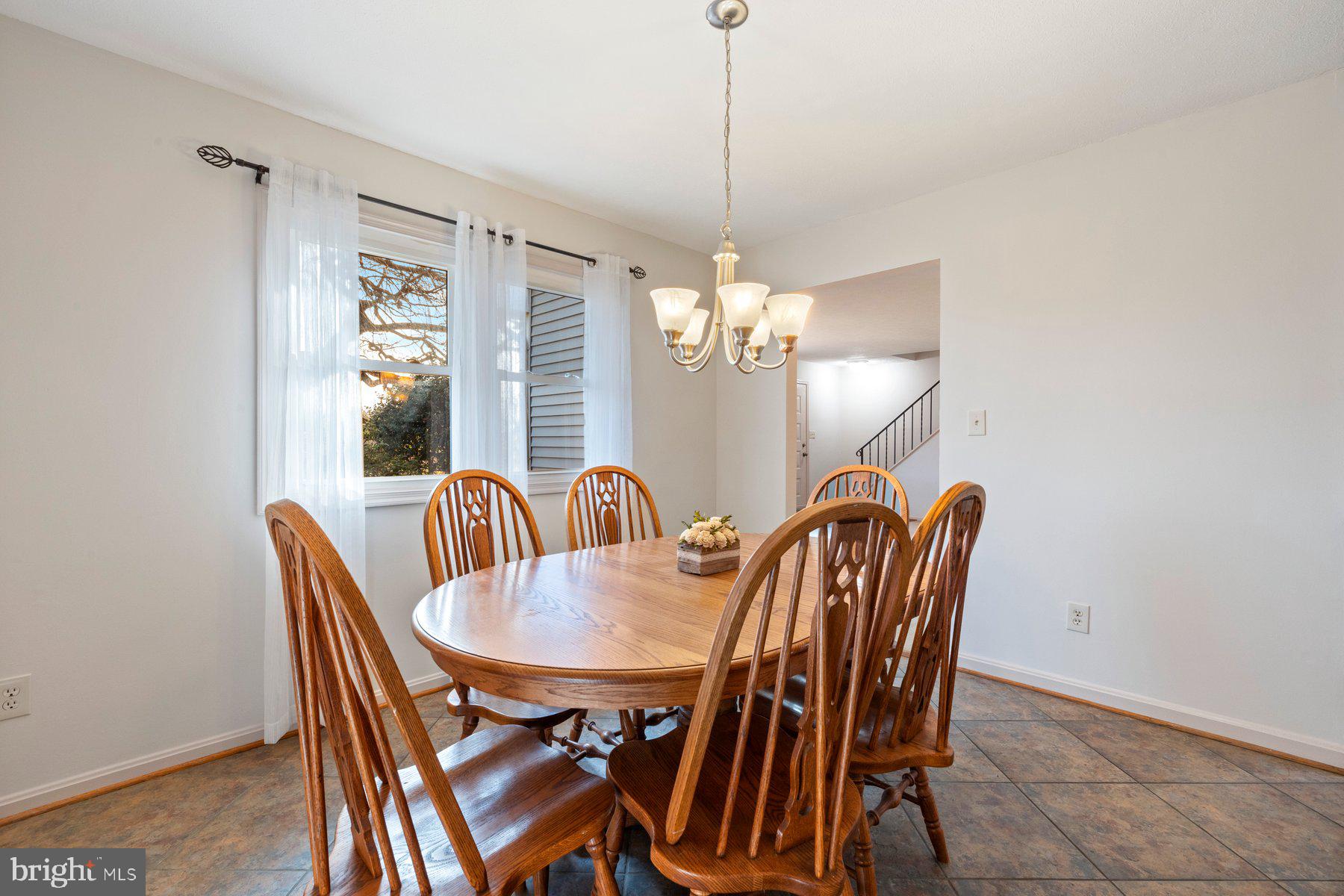 5130 Perry Road Mount Airy, MD 21771 - Photo 9 of 46 a dining room with furniture a chandelier and window