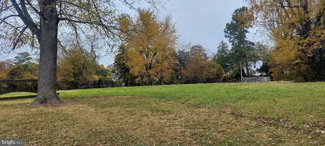 a view of outdoor space with deck and yard