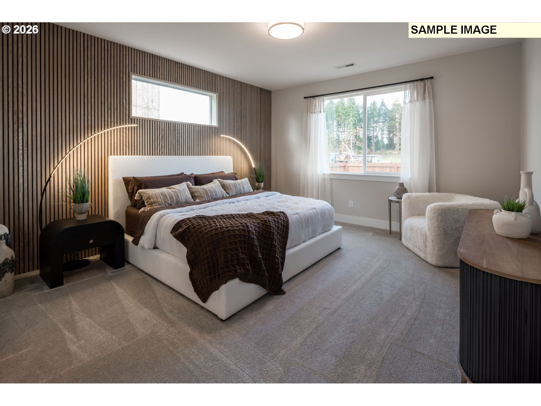 2142 South River Road Kelso, WA 98626 - Photo 6 of 12 a spacious bedroom with a bed and a window