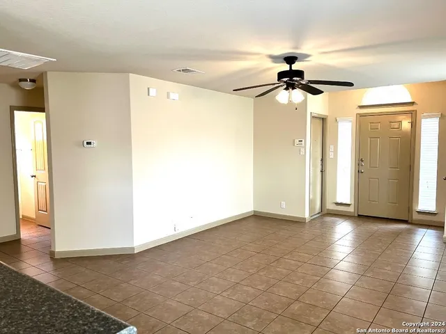 a view of a hallway with a chandelier