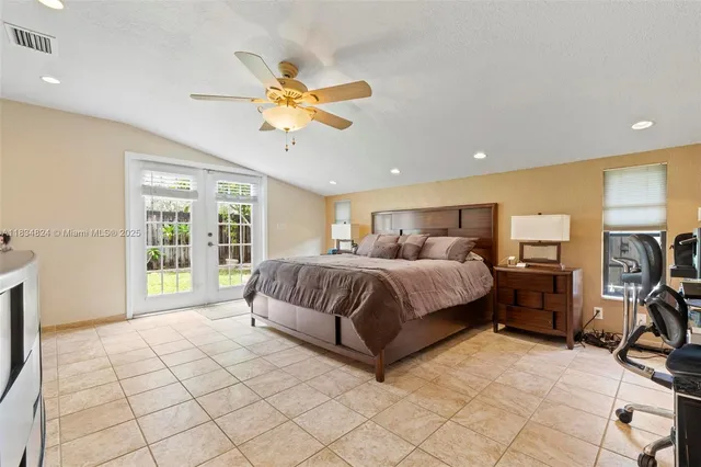 a living room with a bed furniture and a window