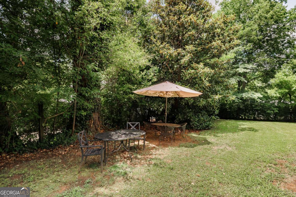 168 Pearl Street Athens, GA 30601 - Photo 30 of 43 a backyard of a house with table and chairs
