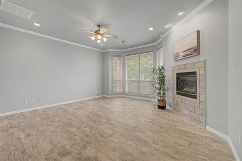 a view of an empty room with a fireplace