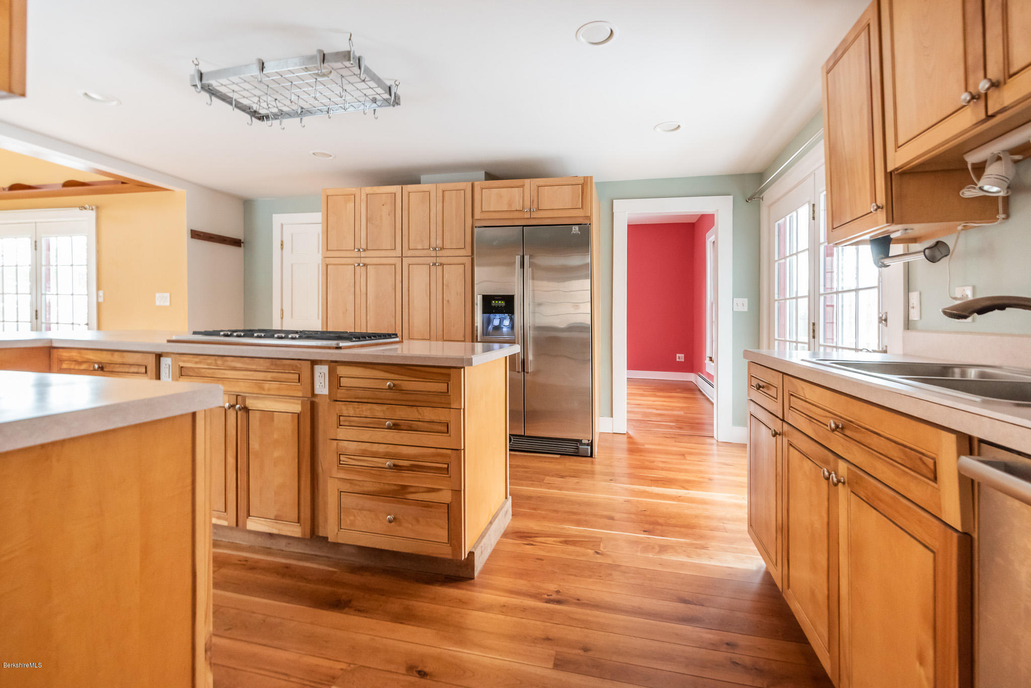 a kitchen with stainless steel appliances granite countertop a stove and a sink