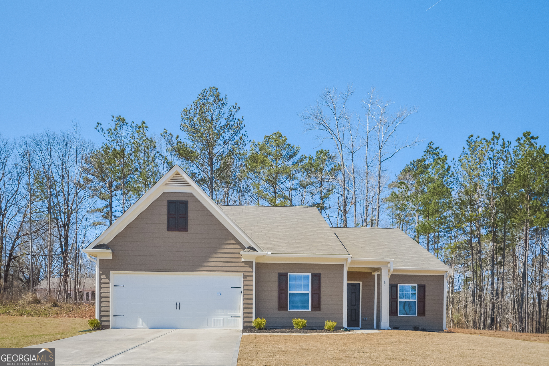 a aerial view of a house with a yard