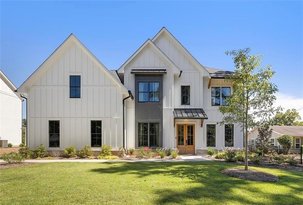 3937 North Cooper Lake Road Southeast Smyrna, GA 30082 - Photo 1 of 1 a front view of a house with a yard