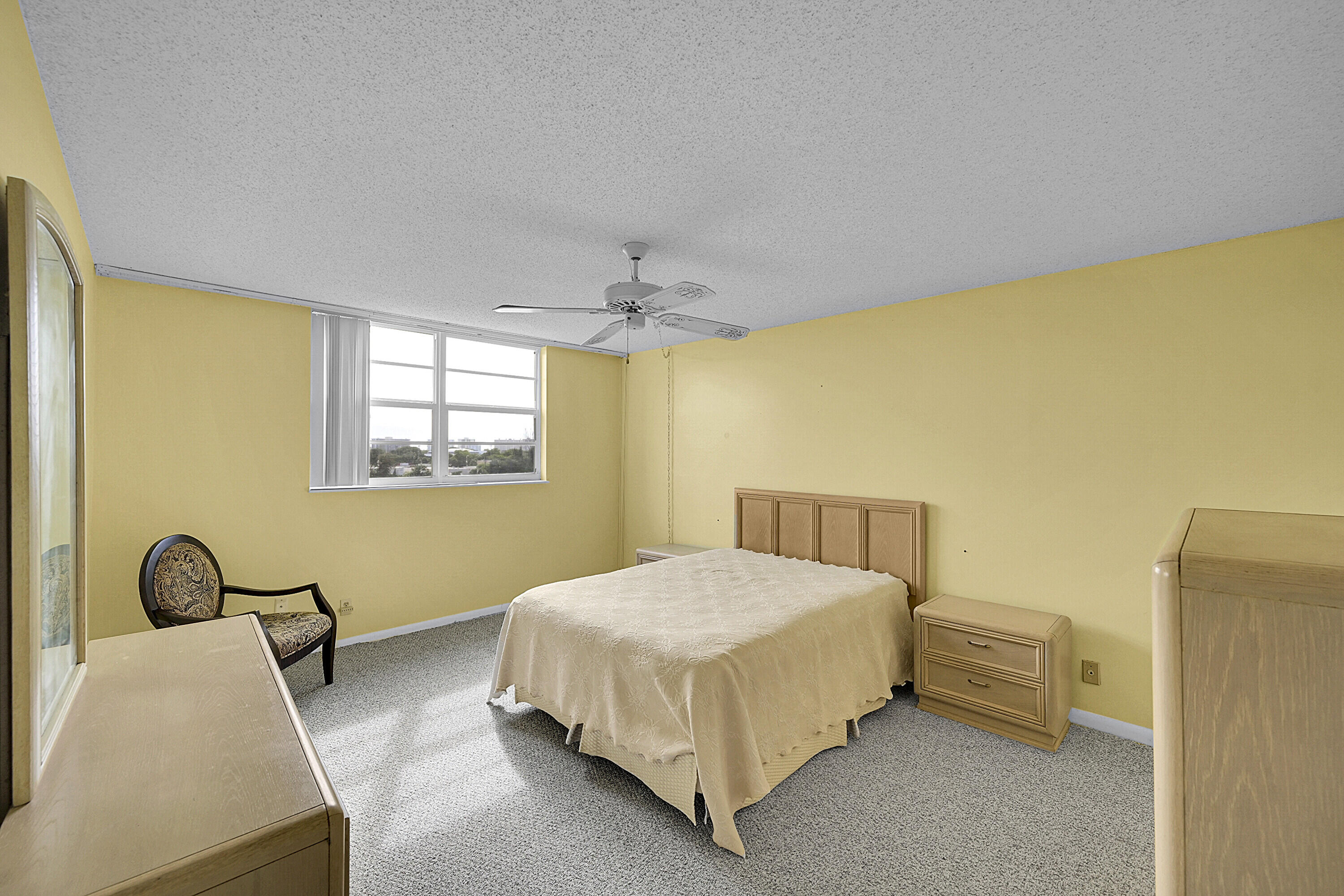 5500 Northwest 2nd Avenue, Unit 614 Boca Raton, FL 33487 - Photo 12 of 24 a bedroom with a bed and a window