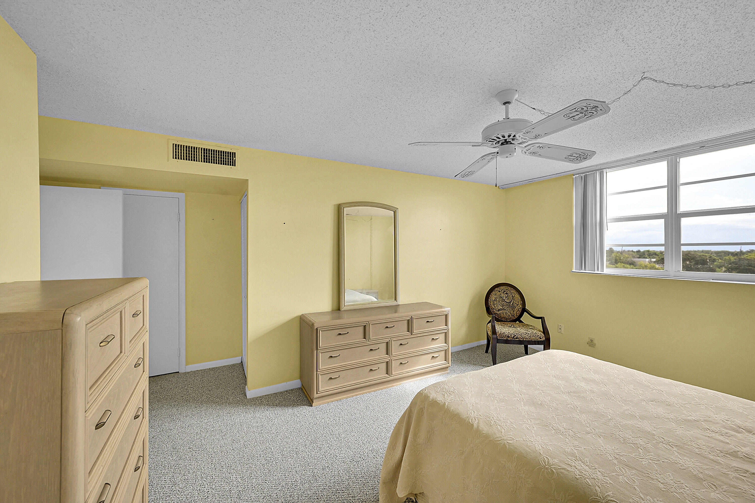 5500 Northwest 2nd Avenue, Unit 614 Boca Raton, FL 33487 - Photo 14 of 24 a bedroom with a bed and a dresser