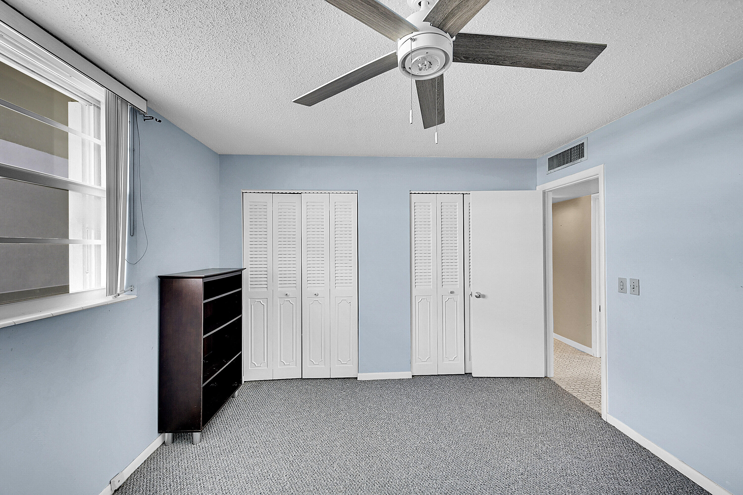 5500 Northwest 2nd Avenue, Unit 614 Boca Raton, FL 33487 - Photo 17 of 24 an empty room with closet and windows