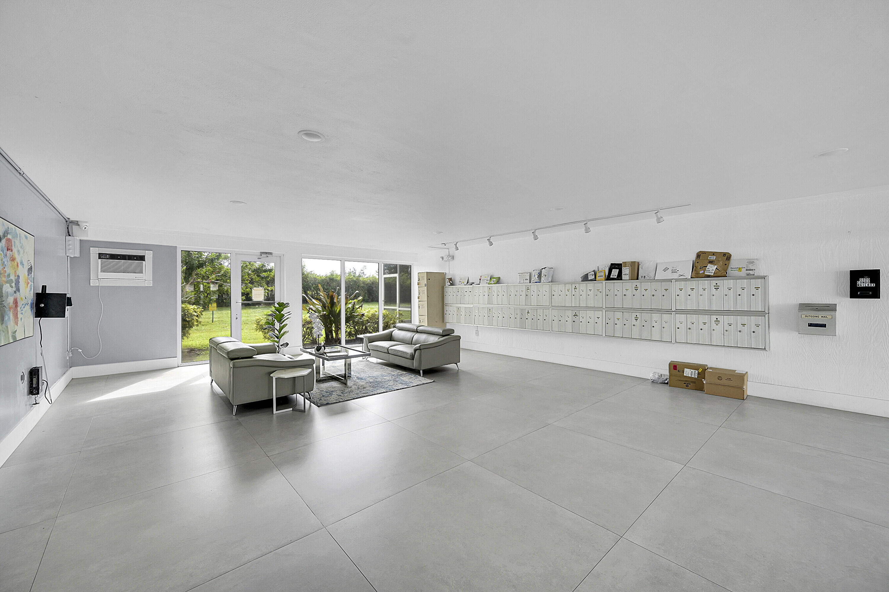 5500 Northwest 2nd Avenue, Unit 614 Boca Raton, FL 33487 - Photo 24 of 24 a view of living room filled with furniture and a large window