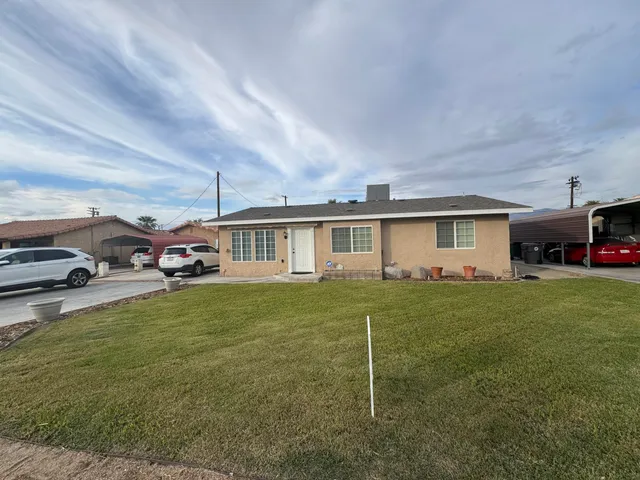 a view of a car parked in front of house