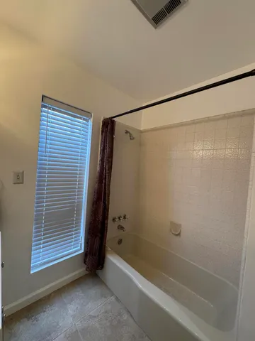 a kitchen with stainless steel appliances granite countertop a sink dishwasher stove and cabinets with wooden floor