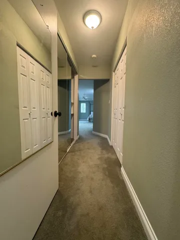 an outdoor kitchen with a stove and lots of car