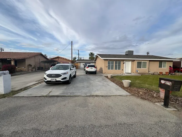 a kitchen with a stove and a refrigerator
