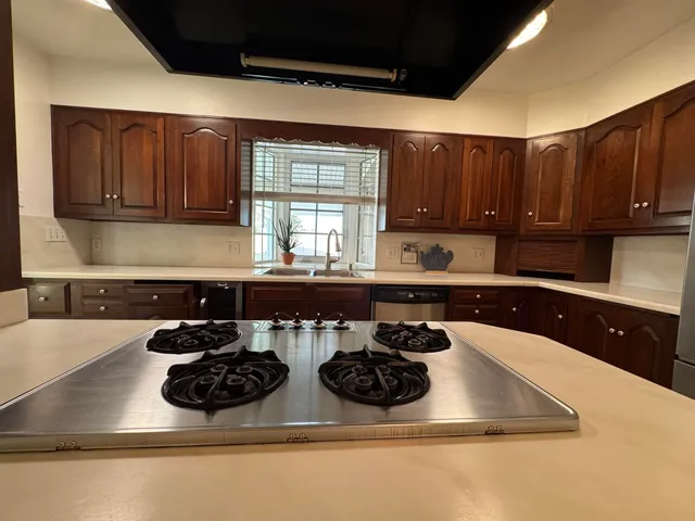 a room with furniture a flat screen tv and a view of living room