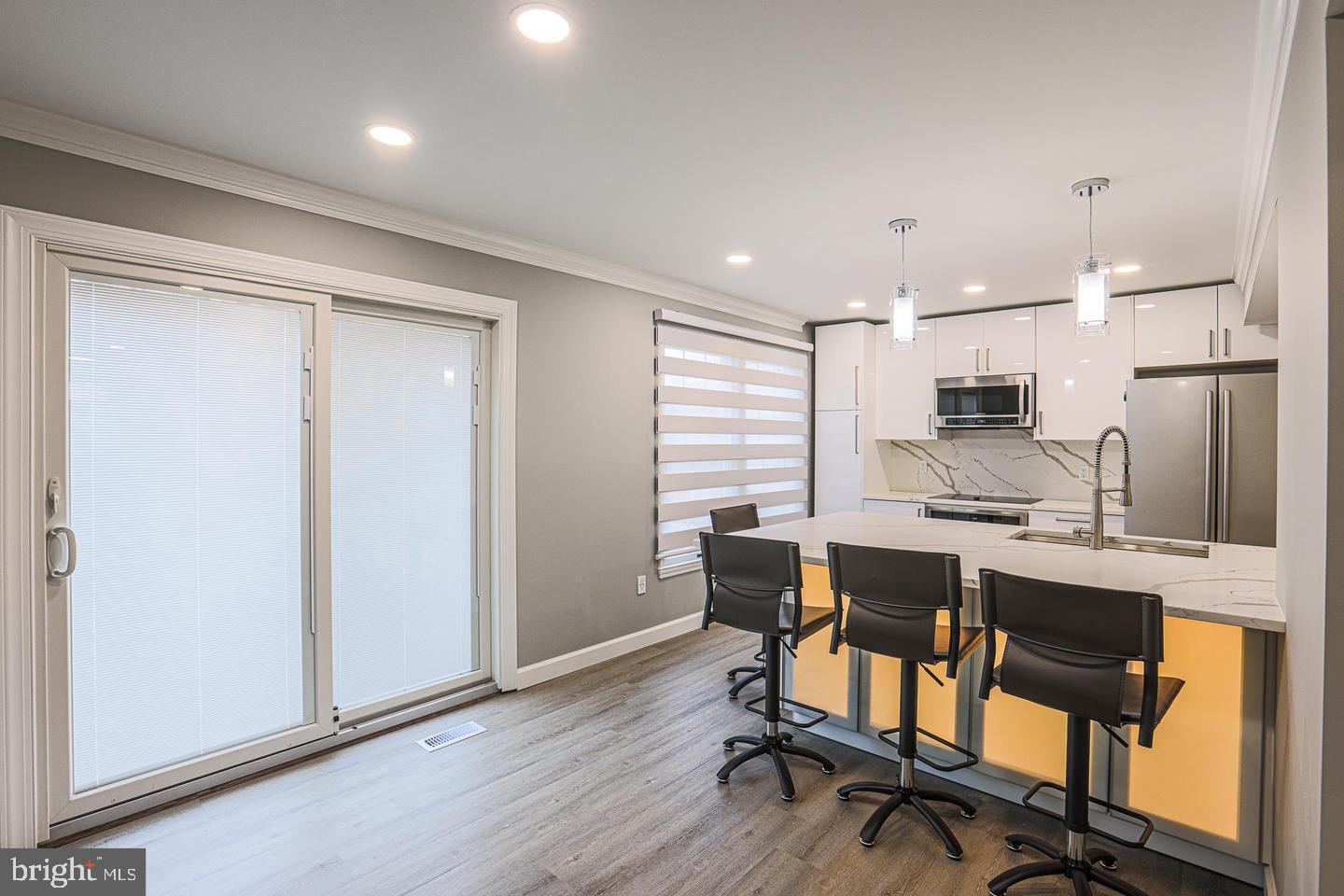 2734 Quarry Heights Way Baltimore, MD 21209 - Photo 9 of 25 a view of a dining room with furniture and a window