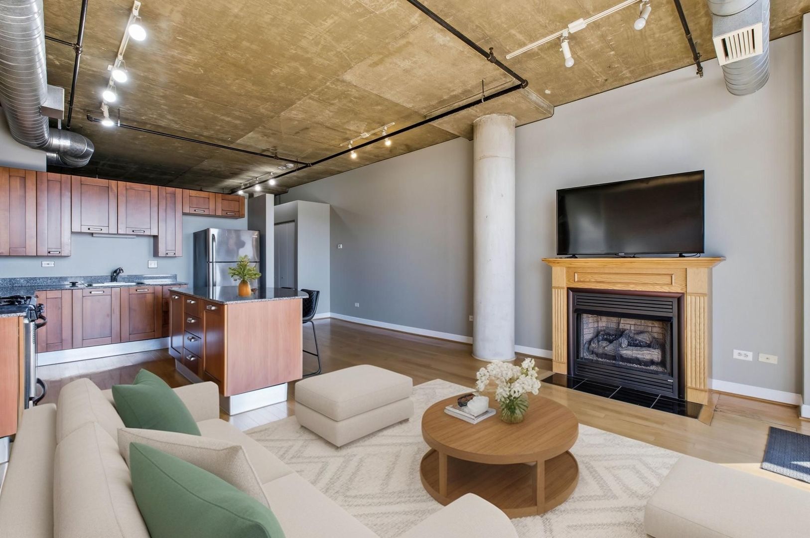 111 South Morgan Street, Unit 701 Chicago, IL 60607 - Photo 3 of 11 a living room with furniture and a fireplace