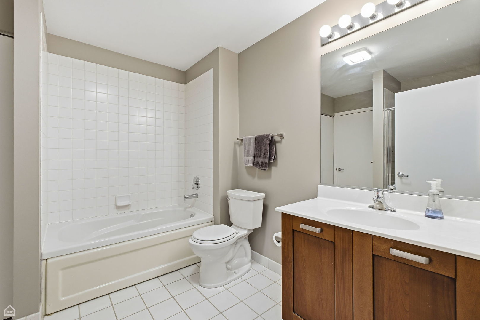 111 South Morgan Street, Unit 701 Chicago, IL 60607 - Photo 7 of 11 a bathroom with a sink a toilet and shower