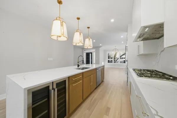 a kitchen with cabinets and window