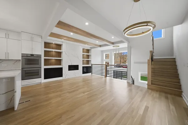 a view of a living room with wooden floor