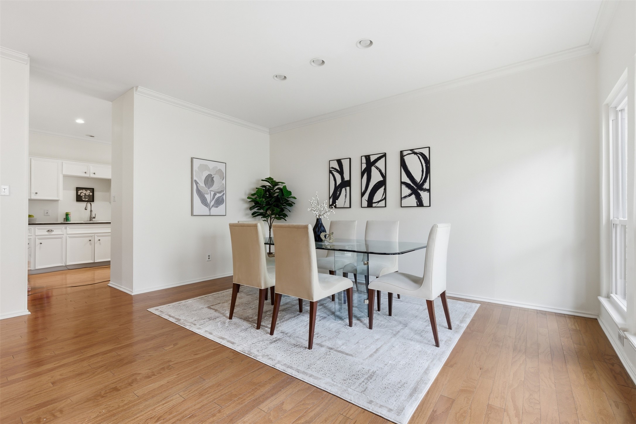 8101 Raintree Place Austin, TX 78759 - Photo 12 of 36 a view of a dining room with furniture and wooden floor