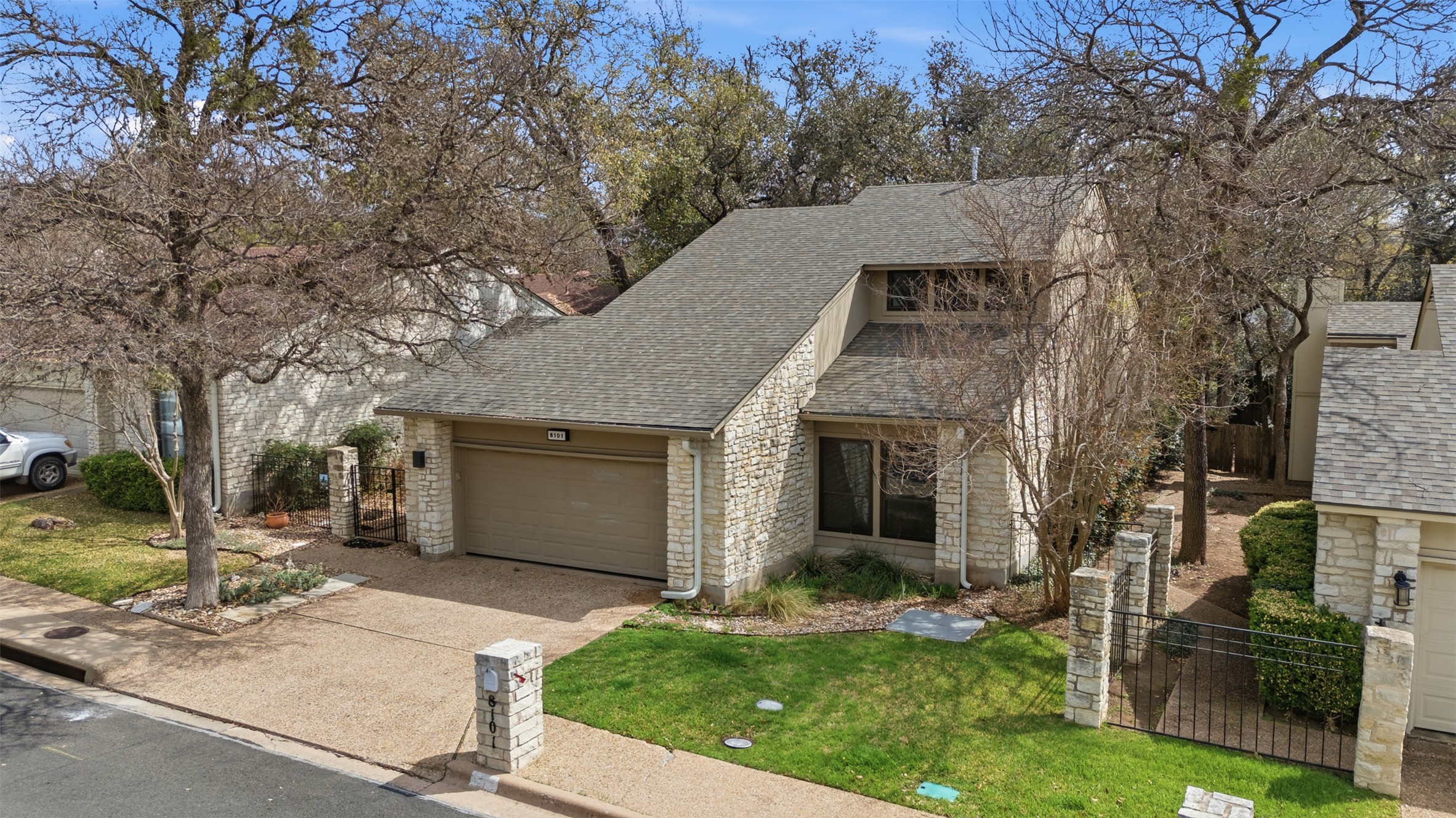 8101 Raintree Place Austin, TX 78759 - Photo 2 of 36 front view of a house with a yard