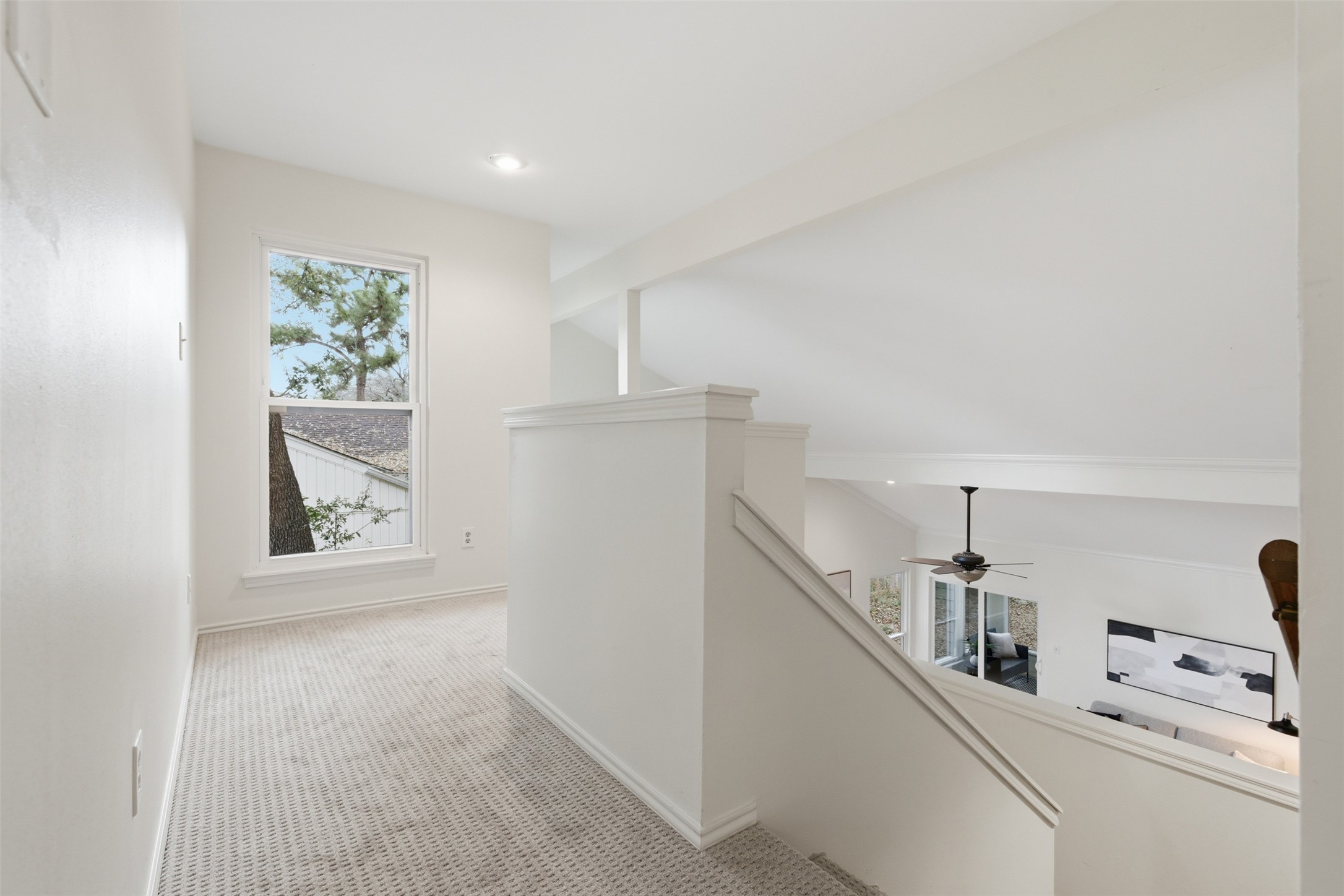 8101 Raintree Place Austin, TX 78759 - Photo 25 of 36 a view of hallway with window and cabinet