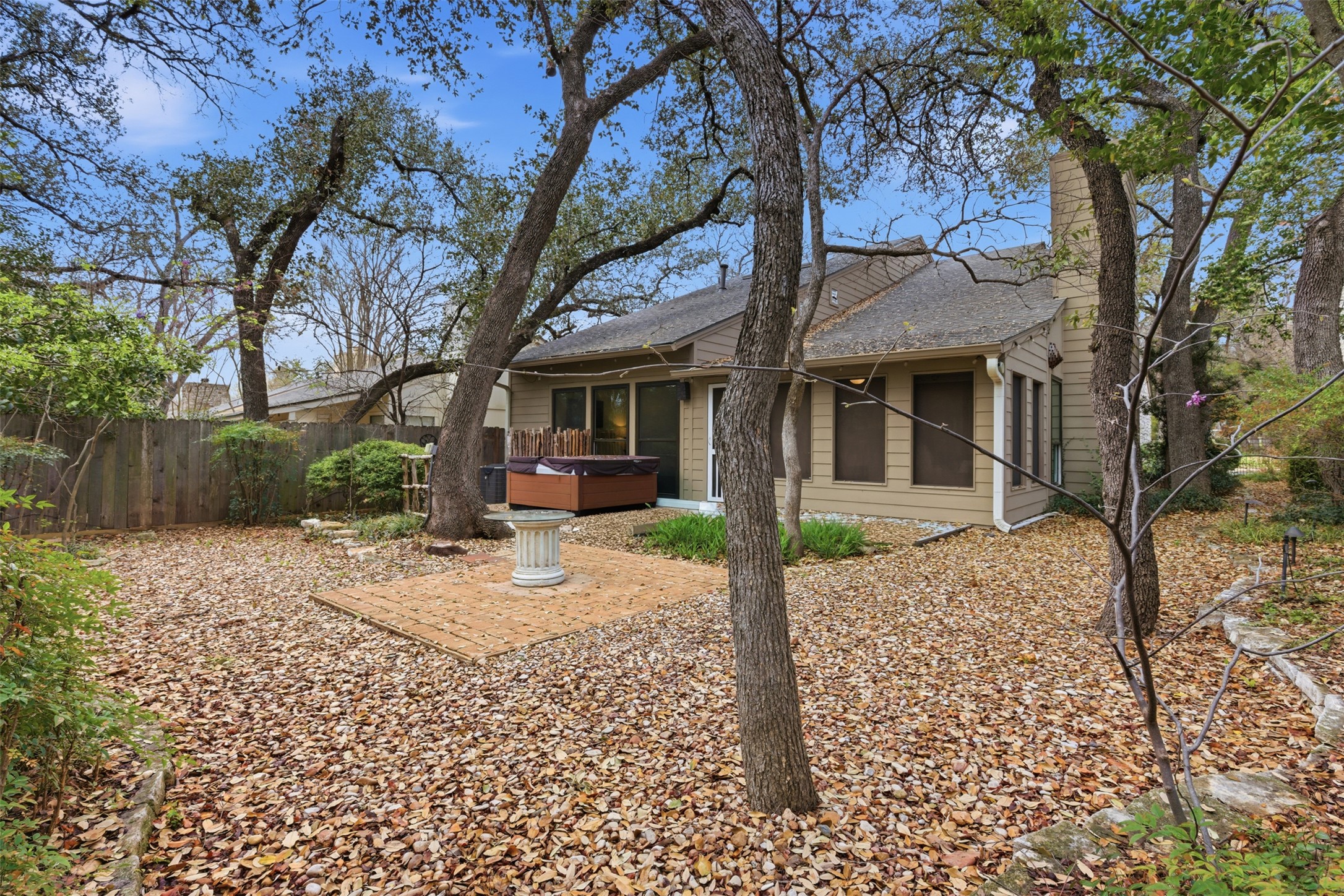 8101 Raintree Place Austin, TX 78759 - Photo 30 of 36 a house with trees in front of it