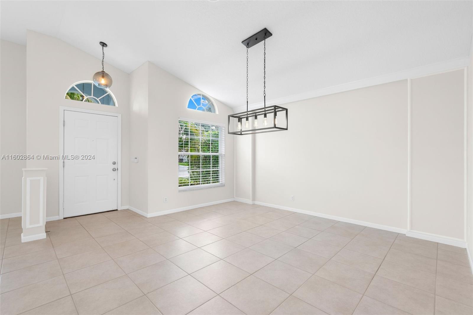 6054 Foster Street Jupiter, FL 33458 - Photo 11 of 50 a view of empty room with windows