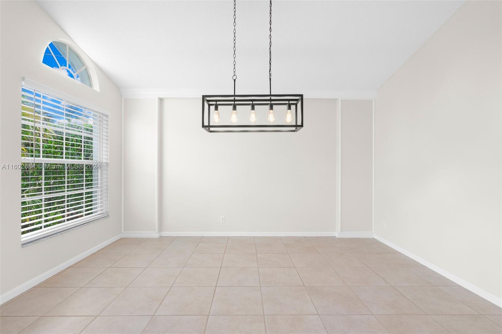 6054 Foster Street Jupiter, FL 33458 - Photo 12 of 50 a view of an empty room with a window