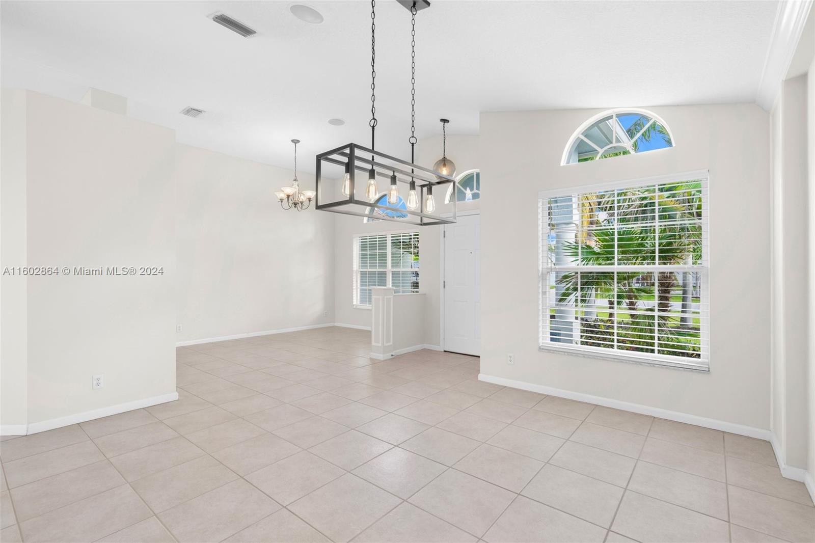 6054 Foster Street Jupiter, FL 33458 - Photo 13 of 50 a view of an empty room with a window