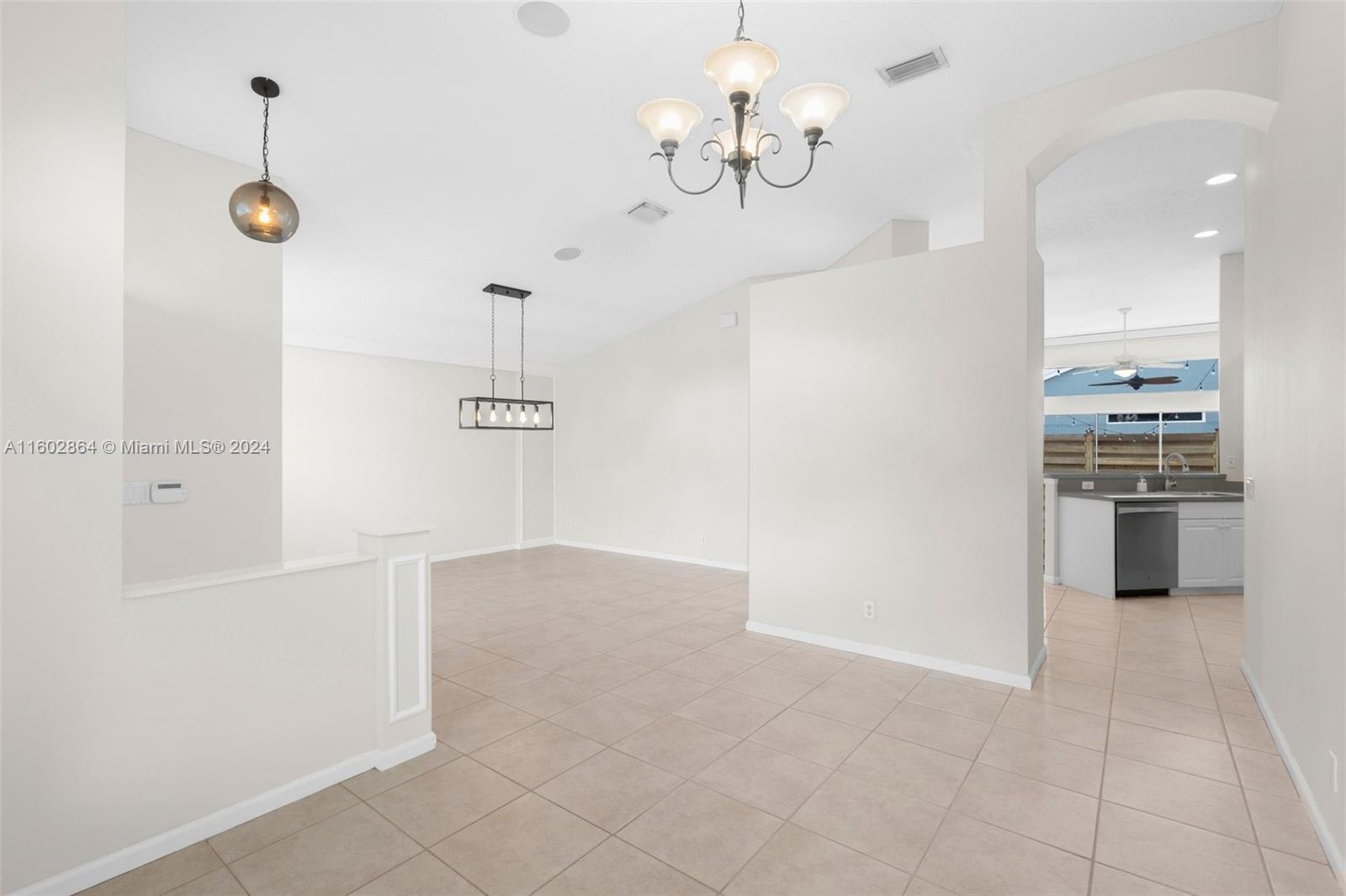 6054 Foster Street Jupiter, FL 33458 - Photo 17 of 50 a view of a kitchen with a sink and stainless steel appliances