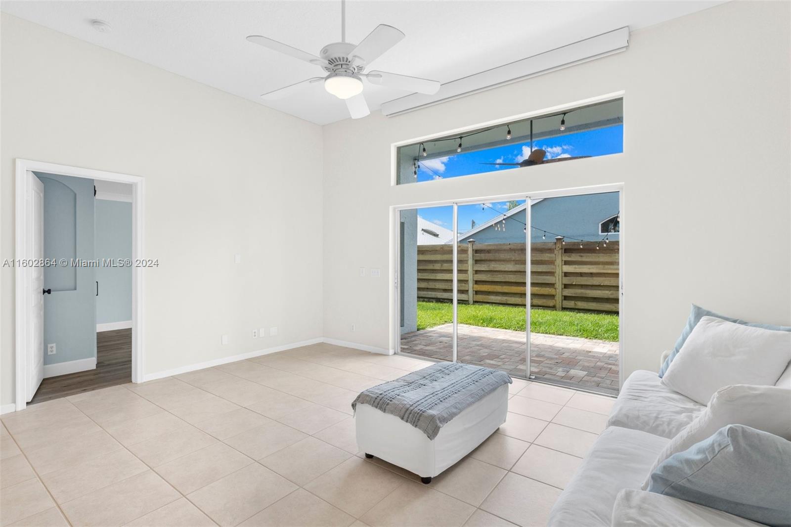 6054 Foster Street Jupiter, FL 33458 - Photo 22 of 50 a living room with furniture and a window