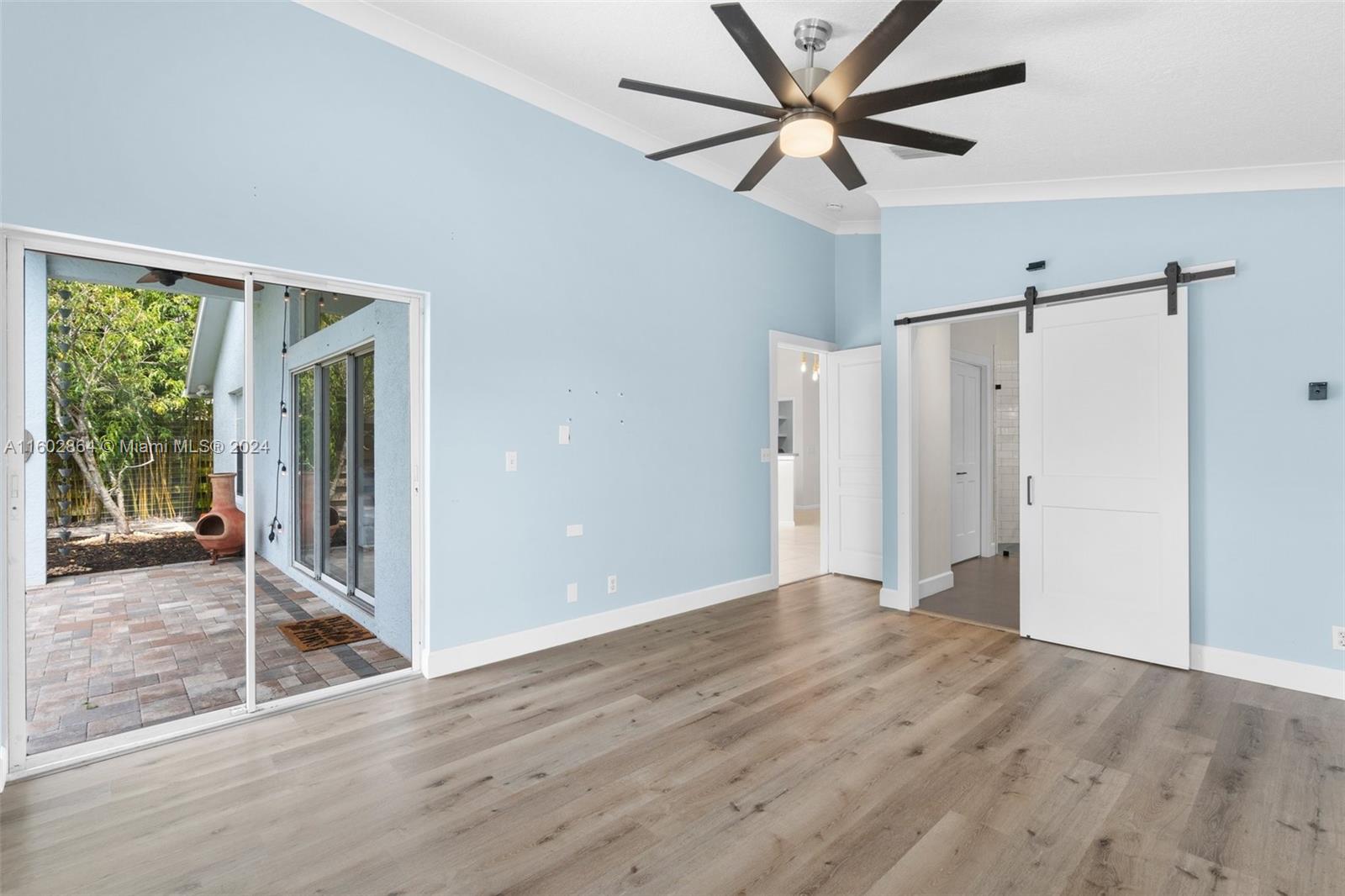 6054 Foster Street Jupiter, FL 33458 - Photo 24 of 50 a view of a livingroom with a ceiling fan and window